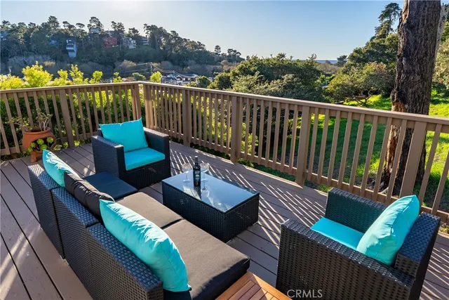 a view of a house with a deck and a patio