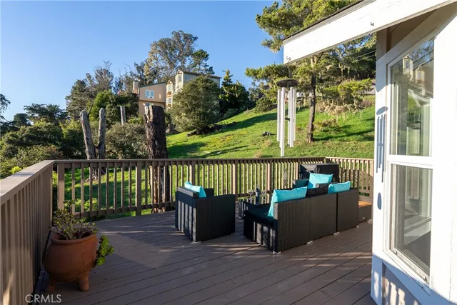 a view of balcony with furniture