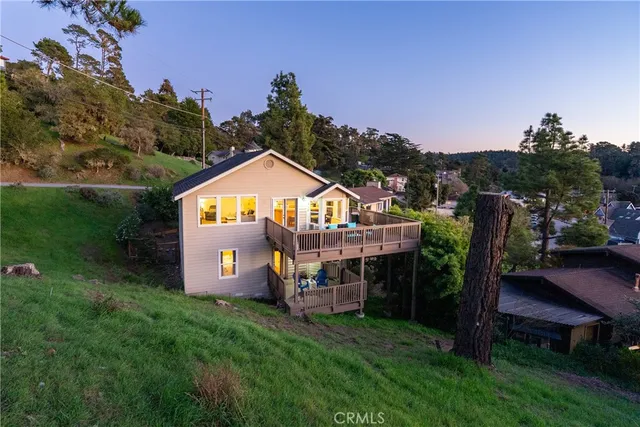 an aerial view of residential house with outdoor space and swimming pool