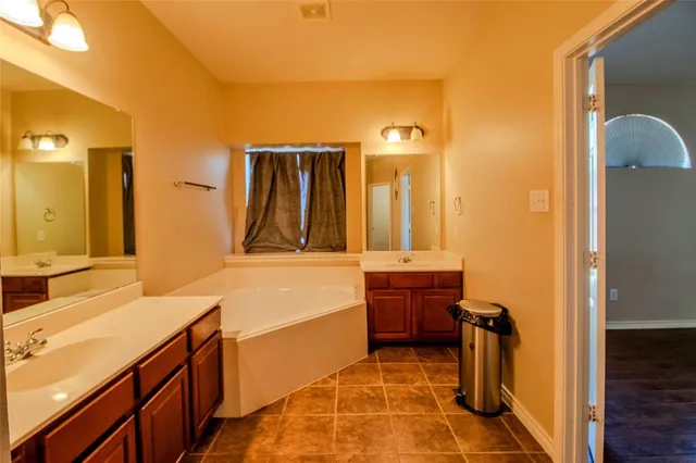 a view of bathroom with a shower and a sink