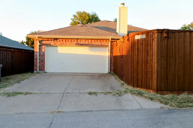 an aerial view of a house with roof deck