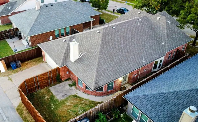 an aerial view of a house with a swimming pool