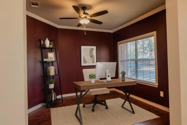 a workspace with furniture and a window
