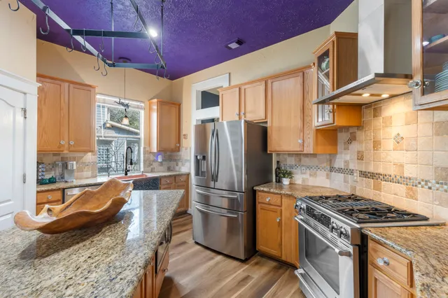 a bed room with a bed and a chandelier