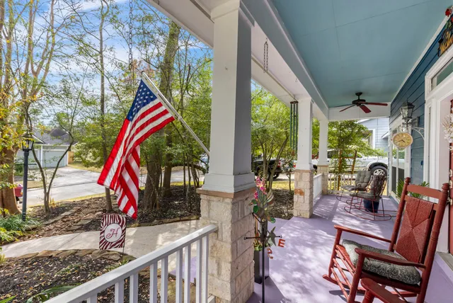 a view of front door with wooden floor and stairs