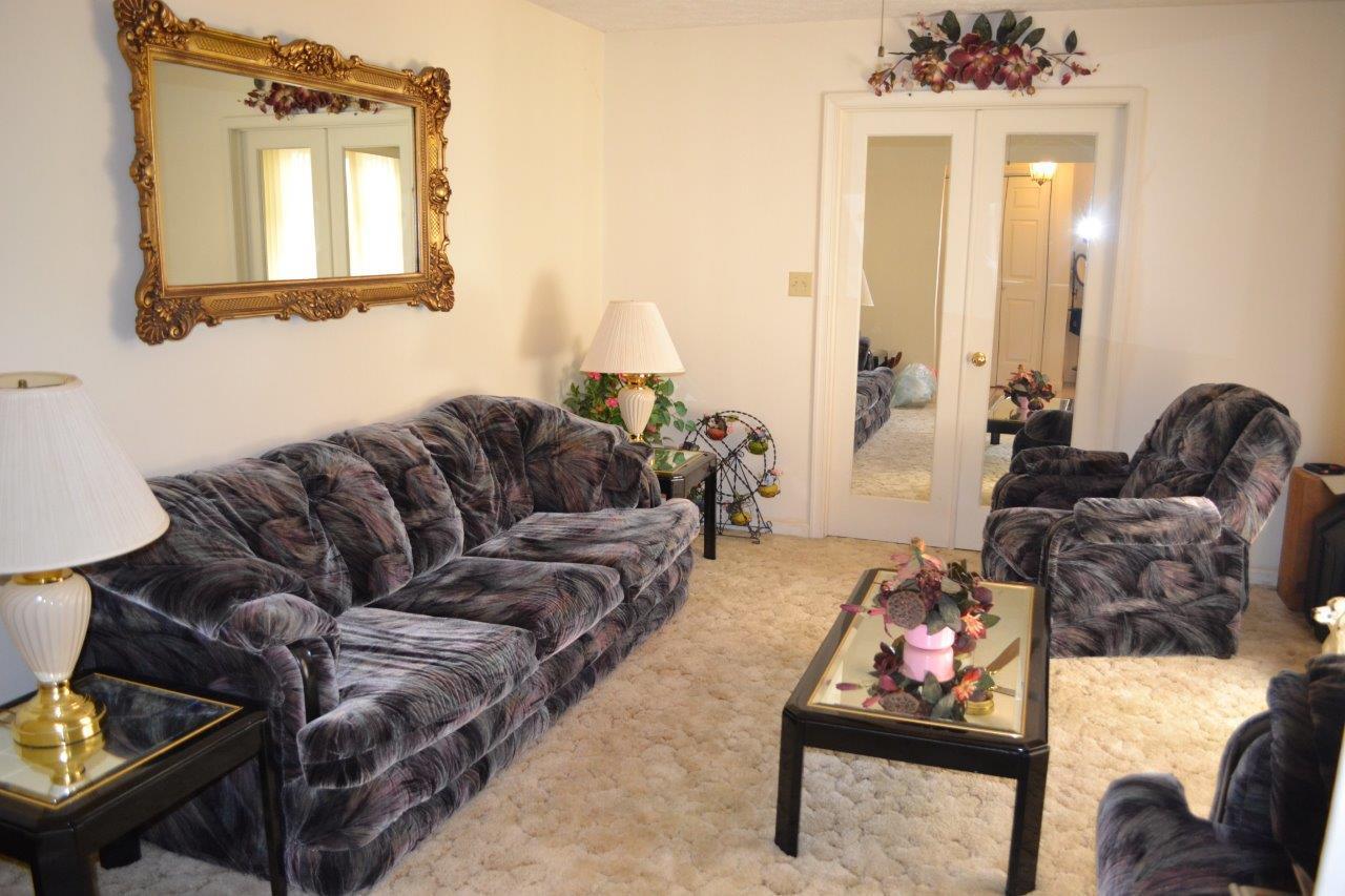 289 Radford Road Southeast Floyd, VA 24091 - Photo 12 of 32 a living room with furniture and a window