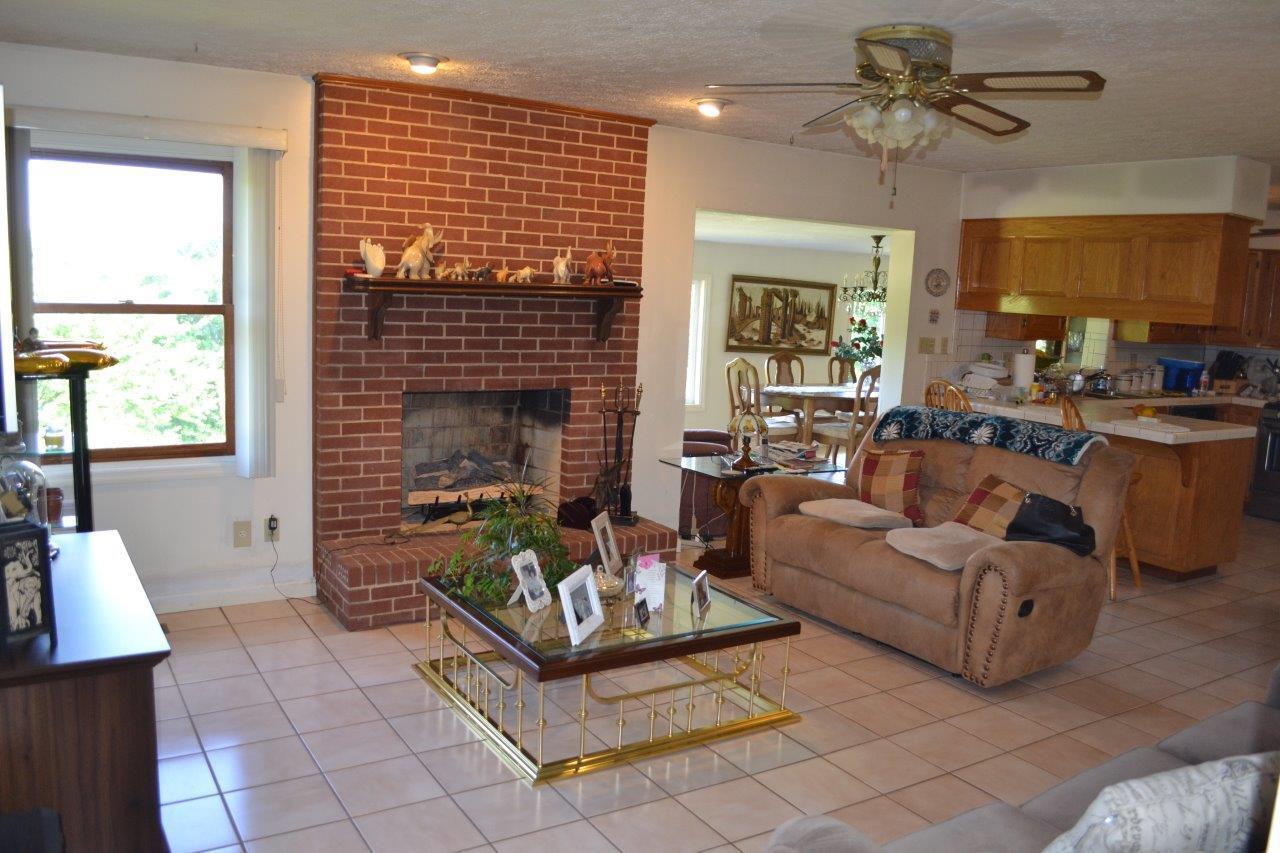 289 Radford Road Southeast Floyd, VA 24091 - Photo 13 of 32 a living room with furniture and a fireplace