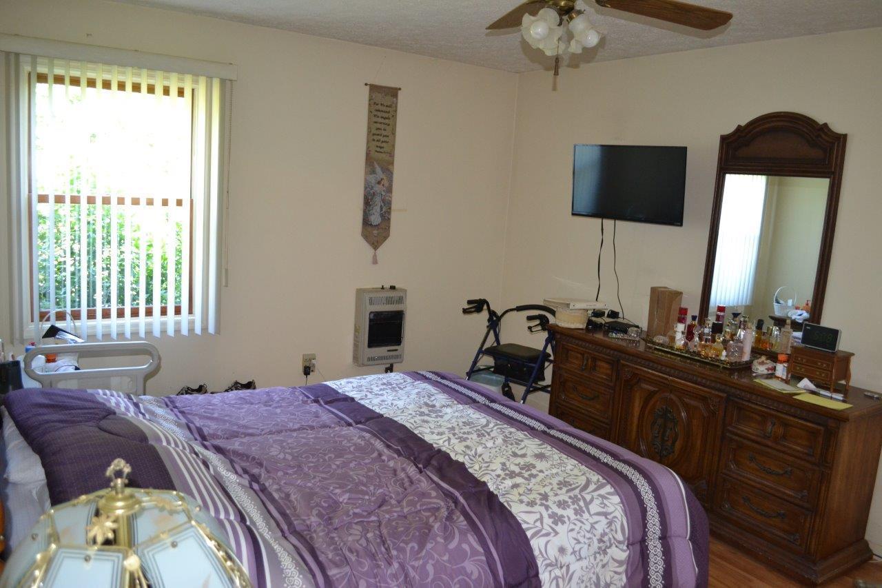 289 Radford Road Southeast Floyd, VA 24091 - Photo 15 of 32 a bedroom with a bed and a flat tv screen on dresser