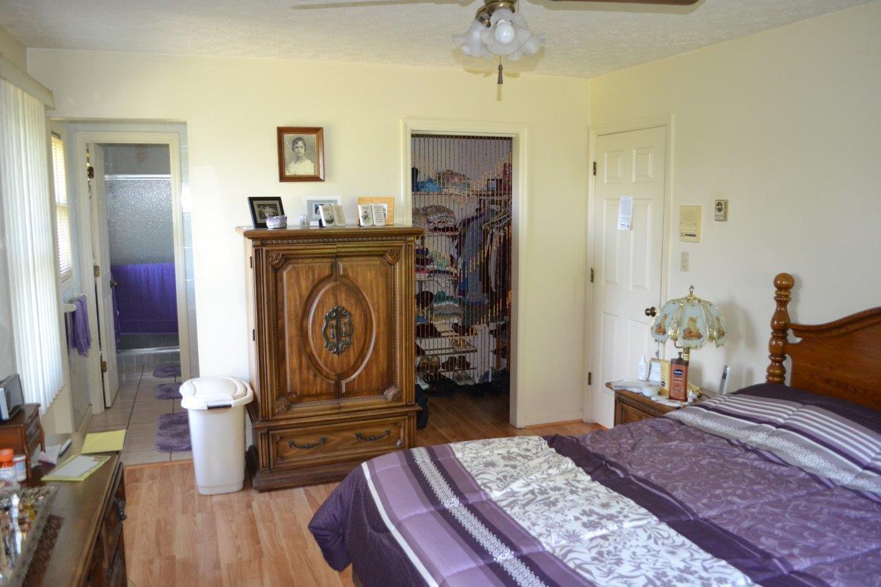 289 Radford Road Southeast Floyd, VA 24091 - Photo 16 of 32 a bedroom with a bed and wooden floor