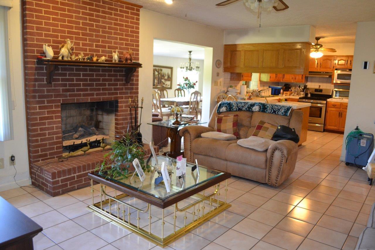 289 Radford Road Southeast Floyd, VA 24091 - Photo 17 of 32 a living room with furniture and a fireplace