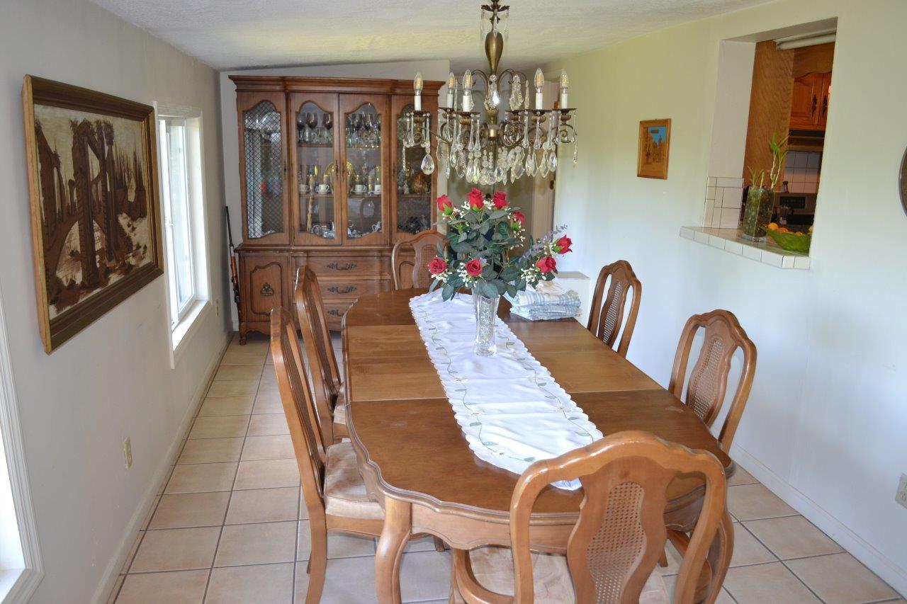289 Radford Road Southeast Floyd, VA 24091 - Photo 20 of 32 a view of a dining room with furniture and chandelier