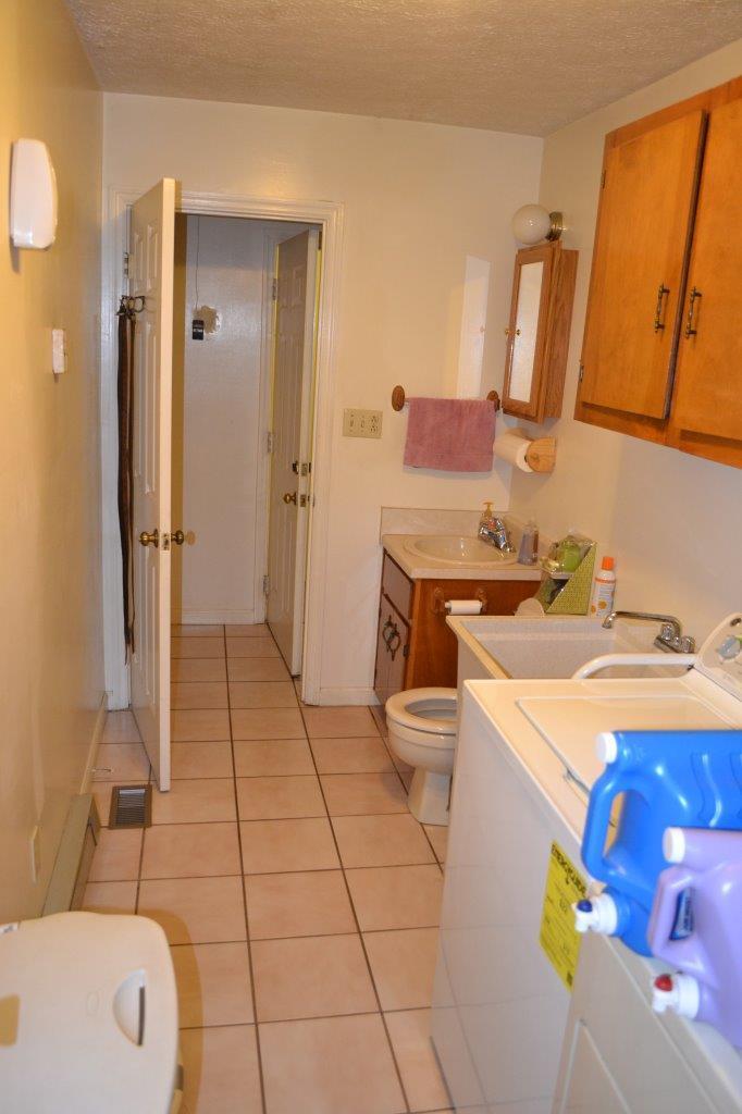 289 Radford Road Southeast Floyd, VA 24091 - Photo 21 of 32 a bathroom with a sink a toilet and shower
