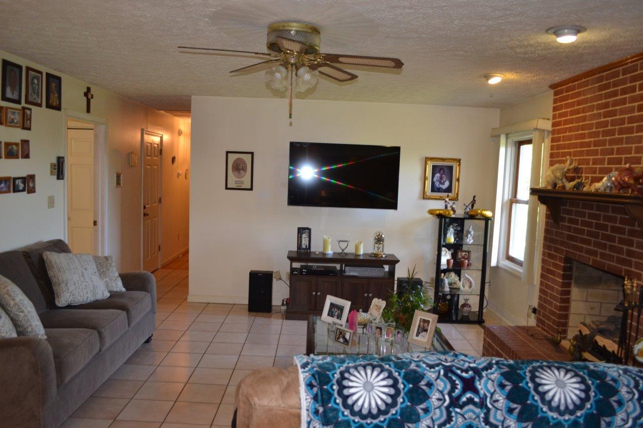 289 Radford Road Southeast Floyd, VA 24091 - Photo 23 of 32 a living room with furniture and a flat screen tv