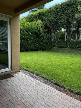 a view of backyard with green space