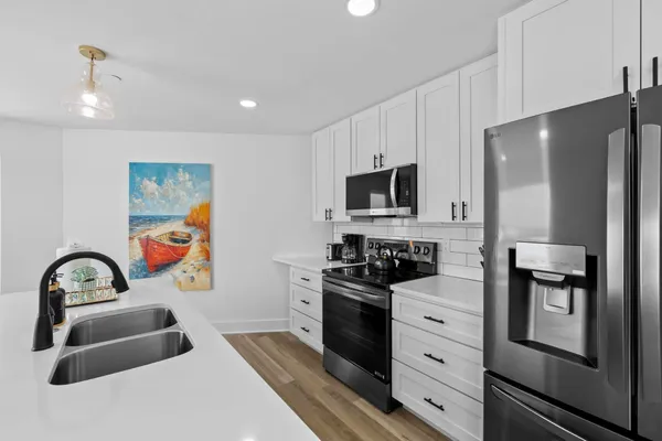 a kitchen with lots of counter top space and dining table