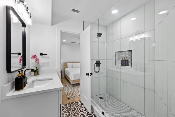 a bathroom with a sink toilet and shower