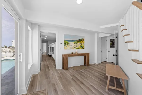 a view of a livingroom with furniture and wooden floor