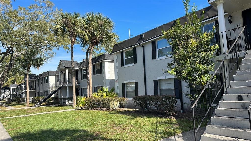7622 Forest City Road, Unit E Orlando, FL 32810 - Photo 1 of 1 a front view of a house with a yard