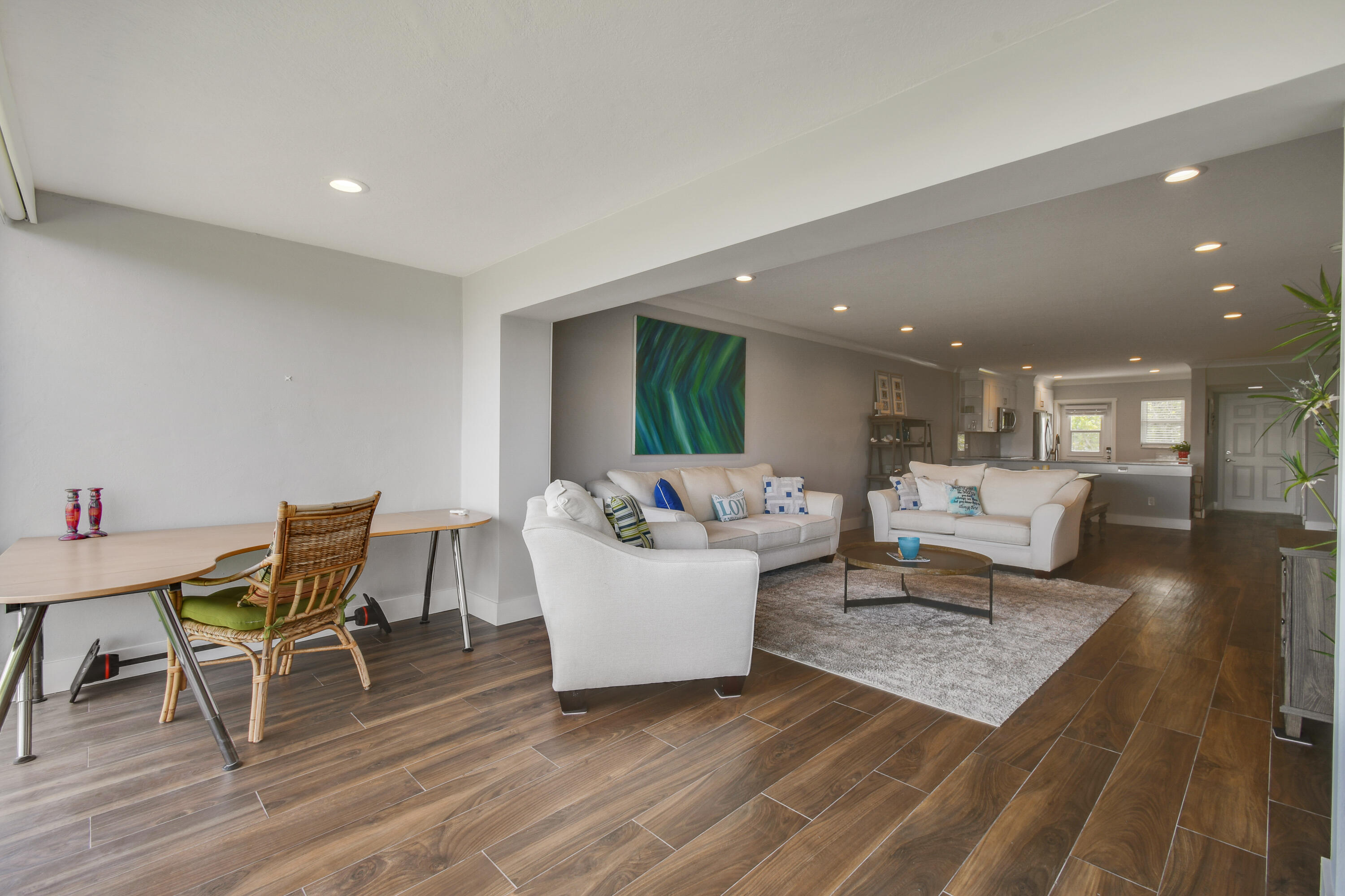 80 Celestial Way, Unit 211 Juno Beach, FL 33408 - Photo 14 of 45 a living room with furniture and wooden floor