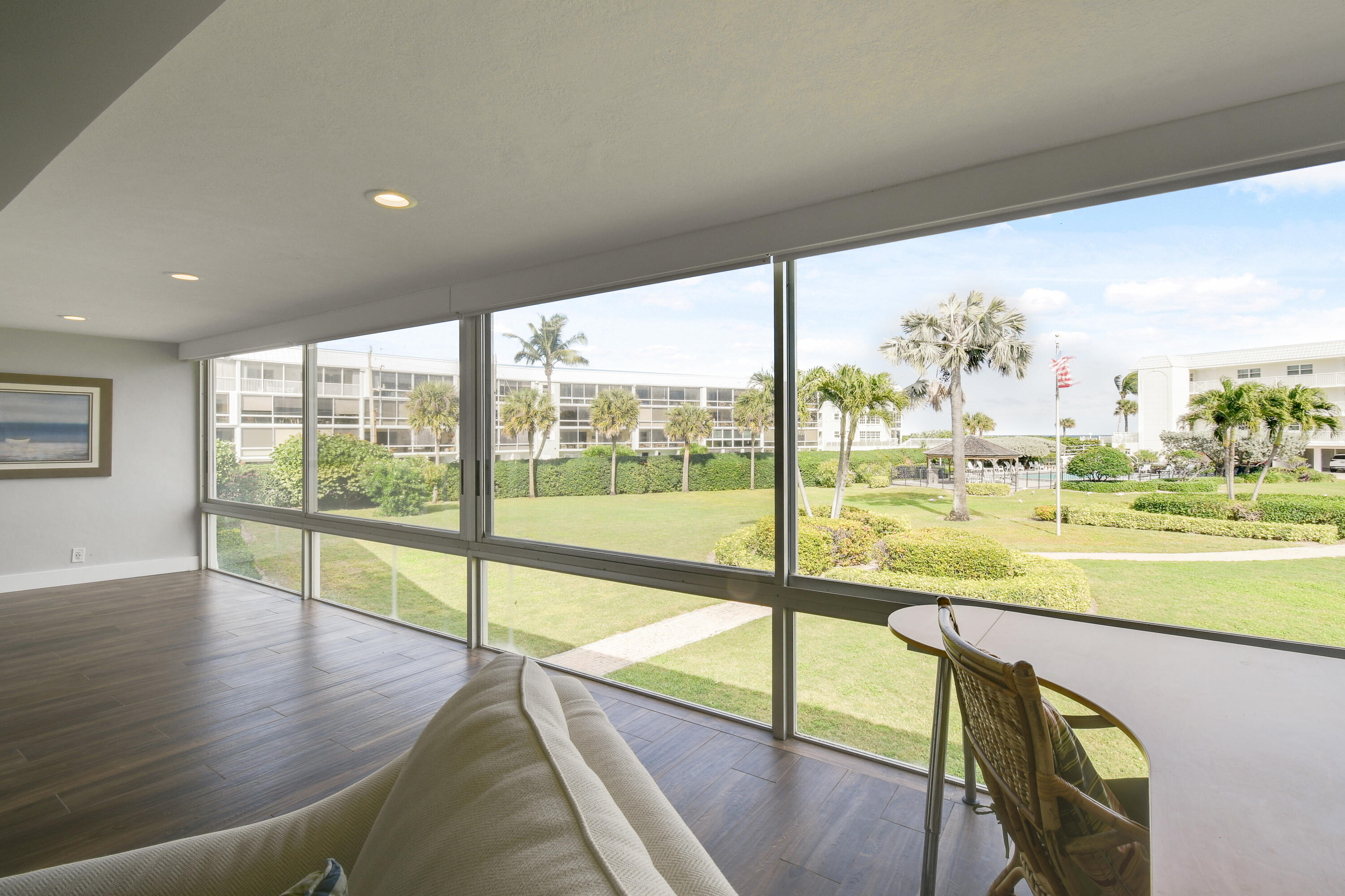 80 Celestial Way, Unit 211 Juno Beach, FL 33408 - Photo 27 of 45 a view of an ocean and trees from a balcony
