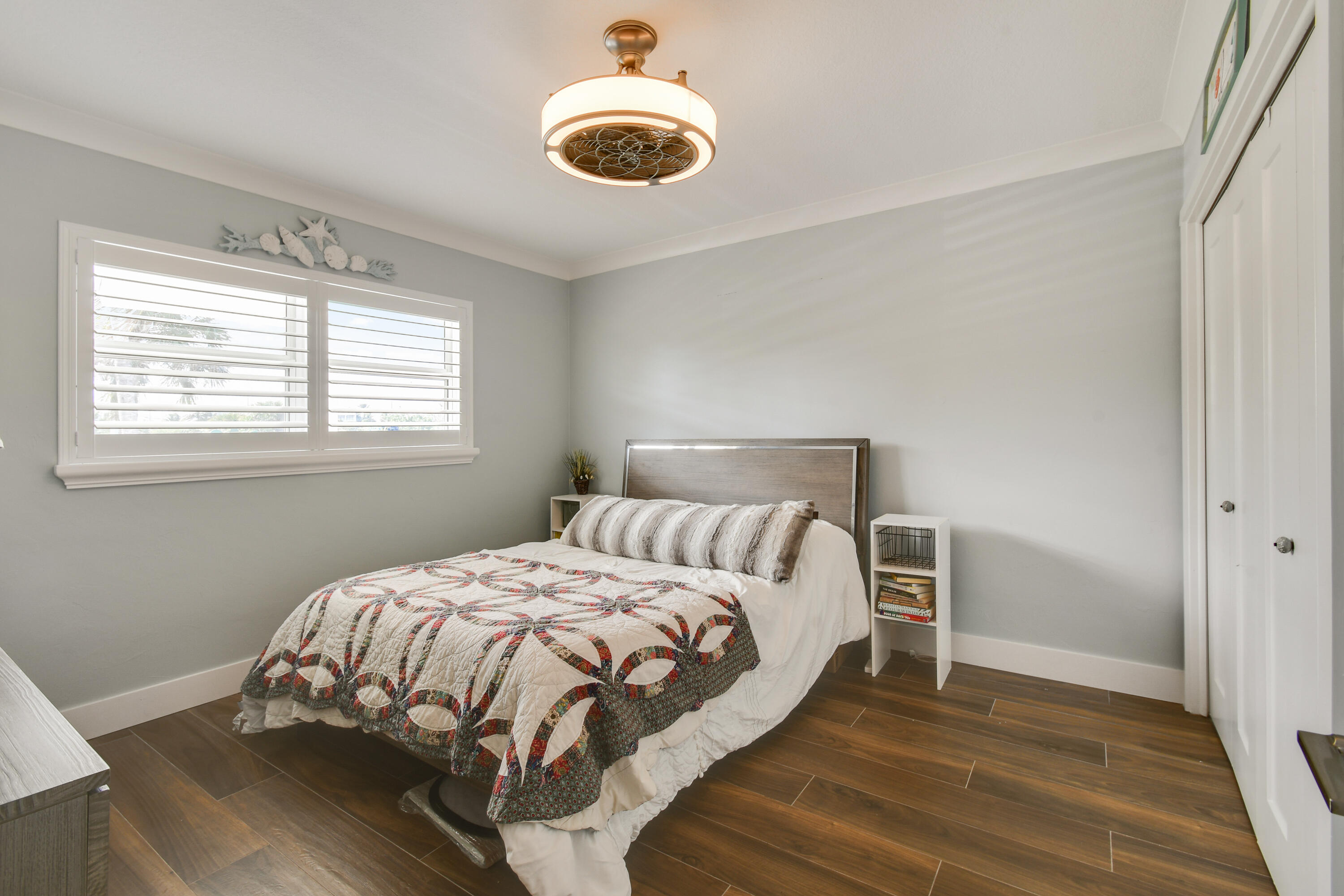 80 Celestial Way, Unit 211 Juno Beach, FL 33408 - Photo 33 of 45 a bedroom with a bed and a window