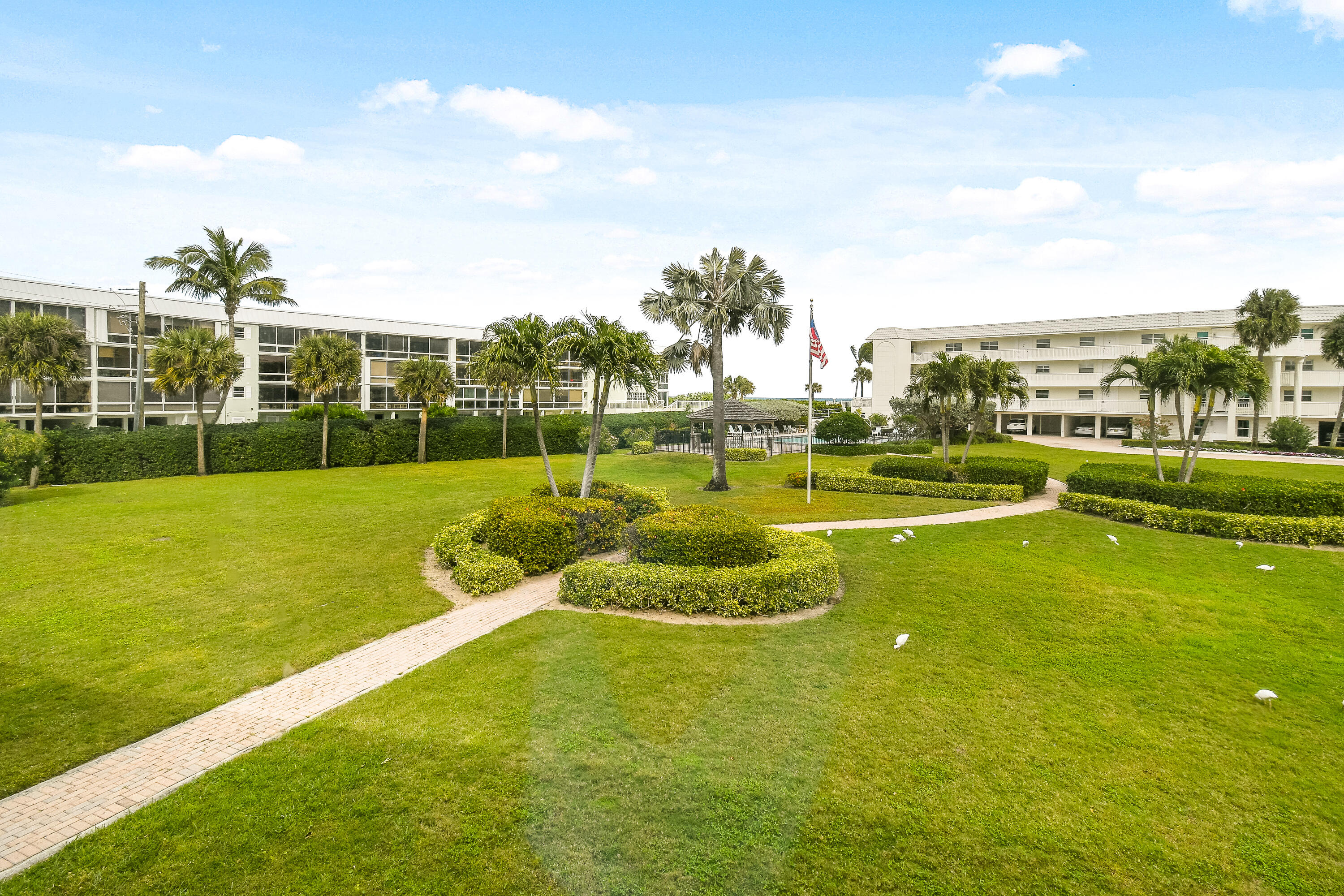 80 Celestial Way, Unit 211 Juno Beach, FL 33408 - Photo 40 of 45 a view of a golf course with a garden