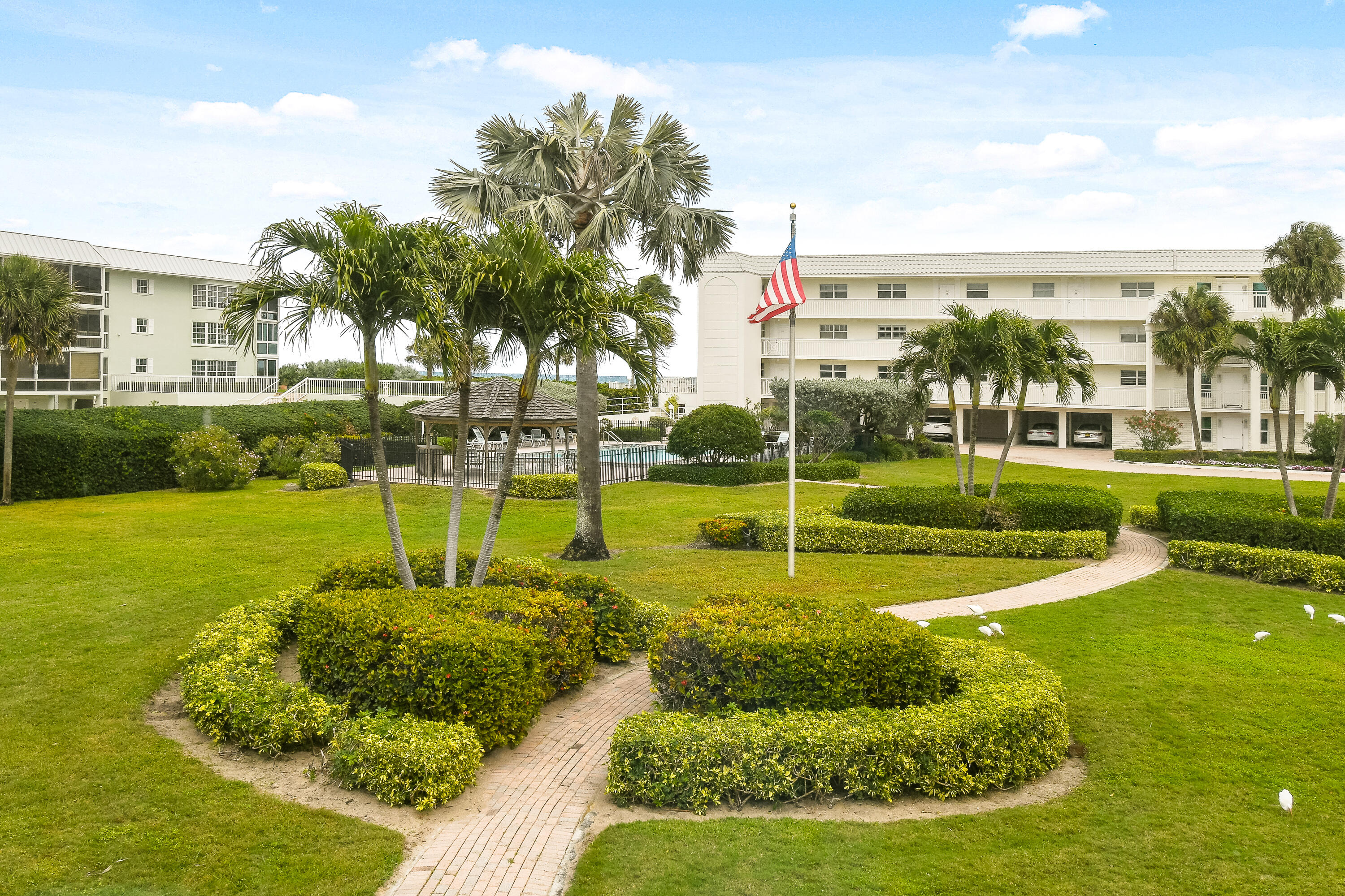 80 Celestial Way, Unit 211 Juno Beach, FL 33408 - Photo 43 of 45 a view of a playground with a swimming pool