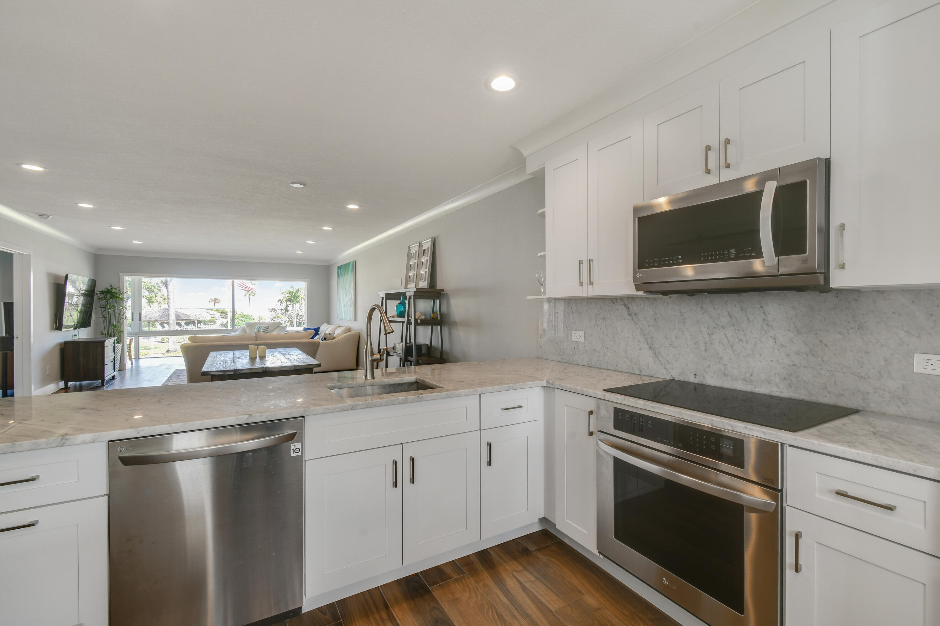 80 Celestial Way, Unit 211 Juno Beach, FL 33408 - Photo 5 of 45 a kitchen with a sink and steel appliances