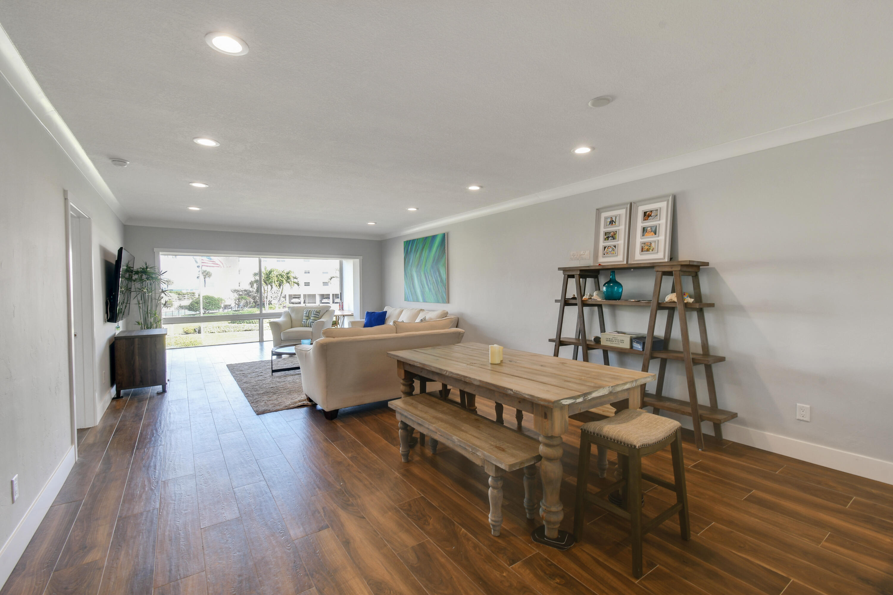 80 Celestial Way, Unit 211 Juno Beach, FL 33408 - Photo 10 of 45 a living room with furniture and a large window