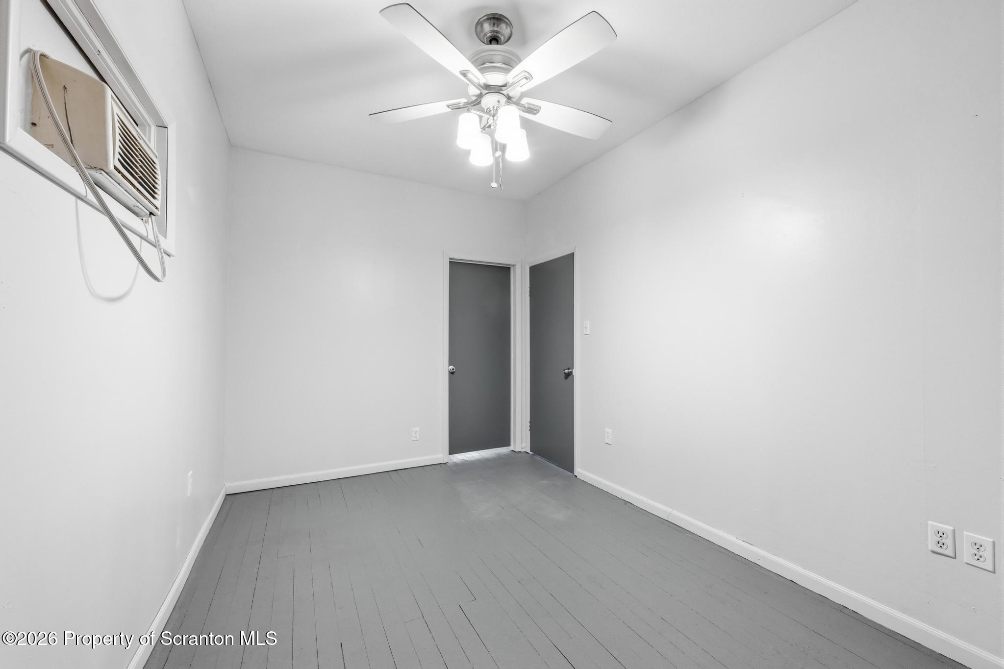 1413 Bulwer Street Scranton, PA 18504 - Photo 15 of 45 a view of an empty room with a chandelier fan
