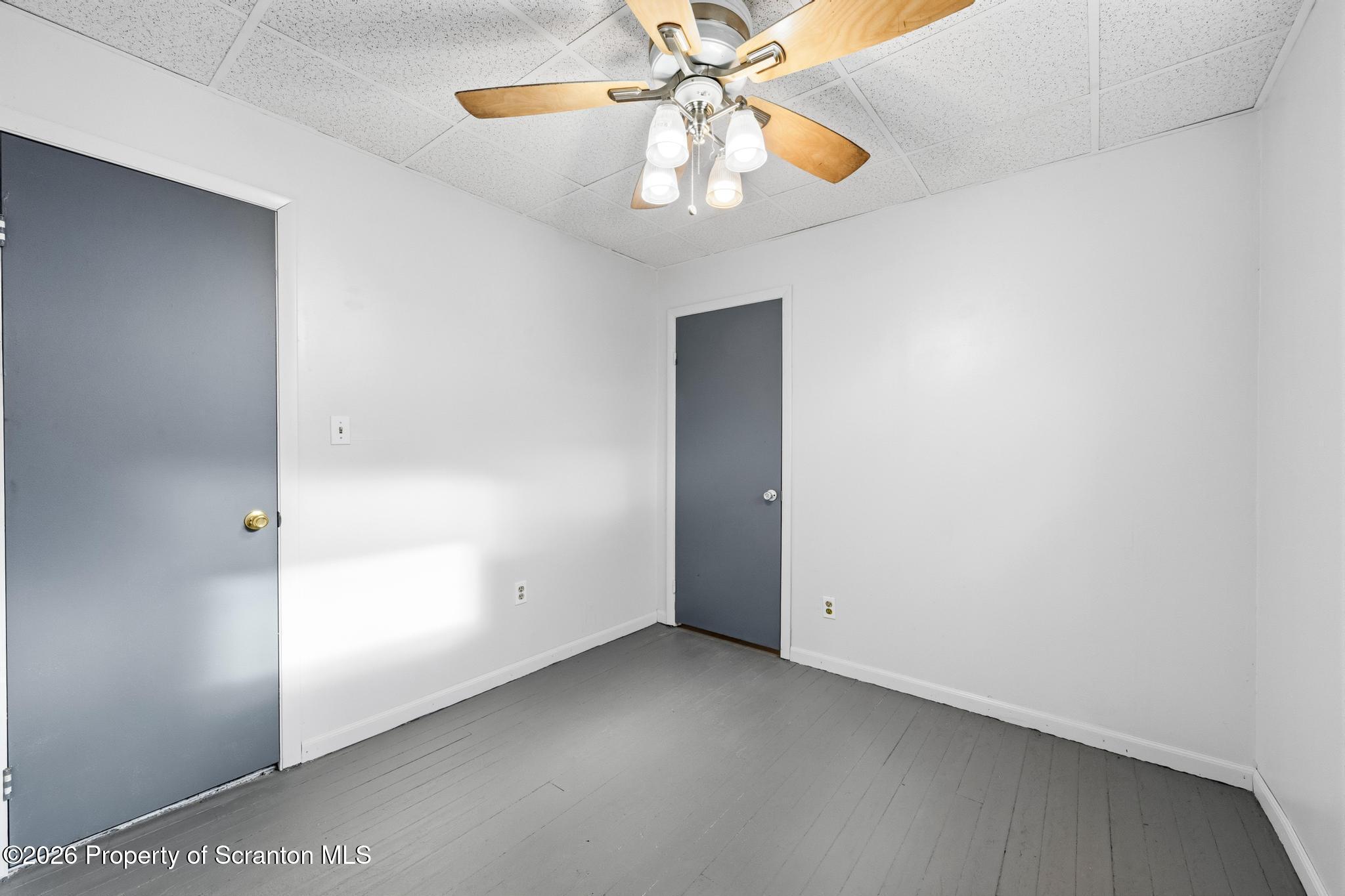 1413 Bulwer Street Scranton, PA 18504 - Photo 17 of 45 an empty room with chandelier fan