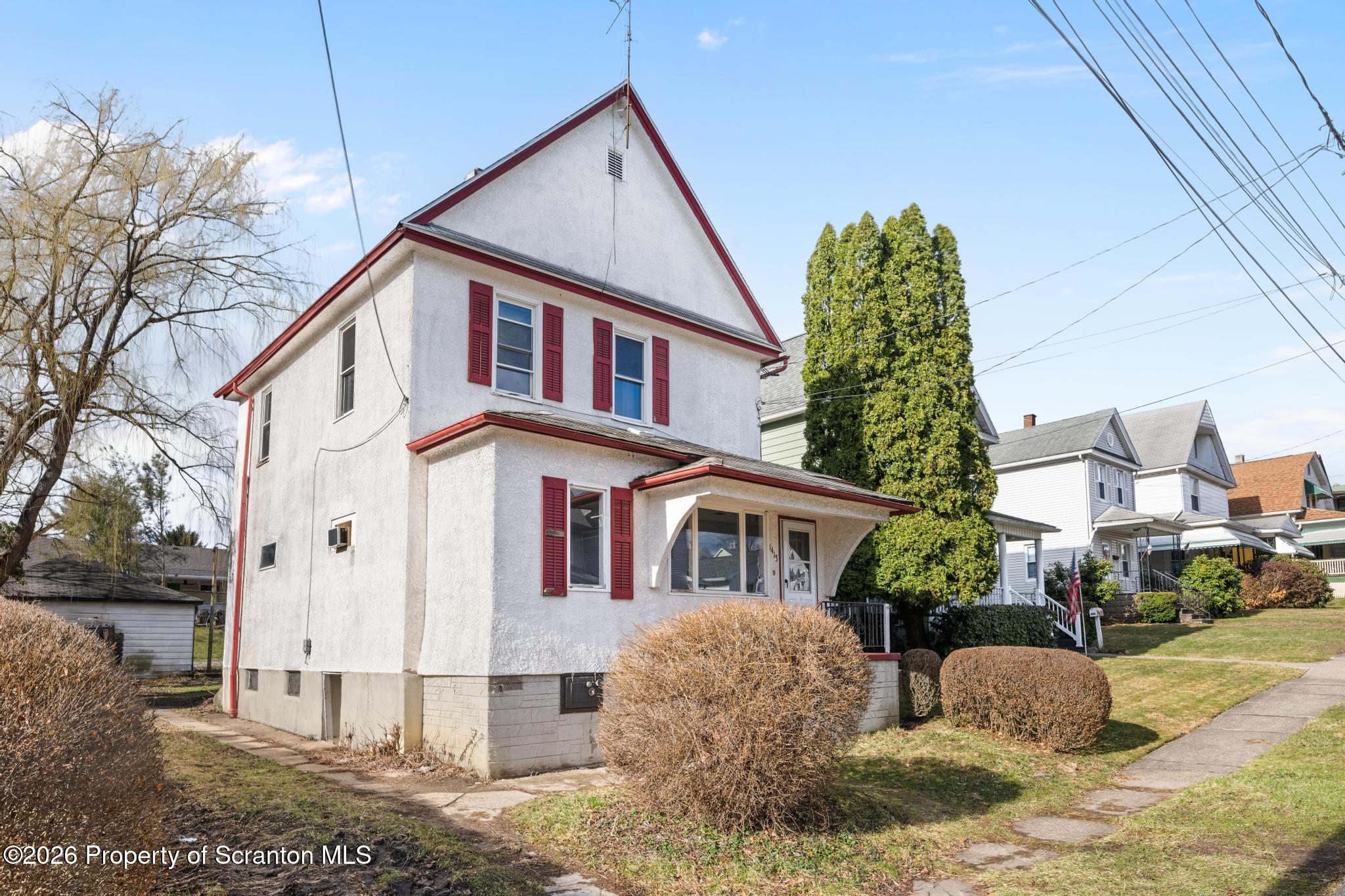 1413 Bulwer Street Scranton, PA 18504 - Photo 2 of 45 a front view of a house with a yard