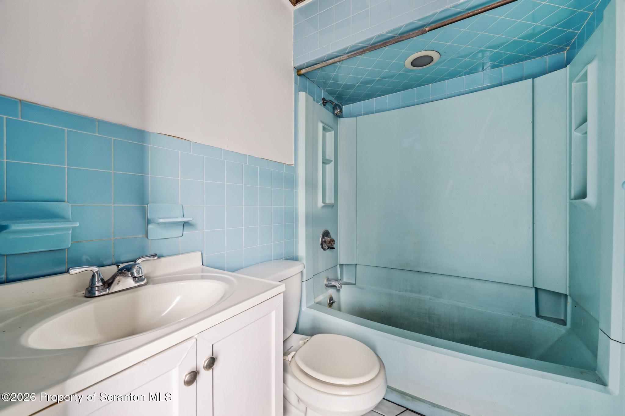 1413 Bulwer Street Scranton, PA 18504 - Photo 25 of 45 a bathroom with a sink toilet and shower
