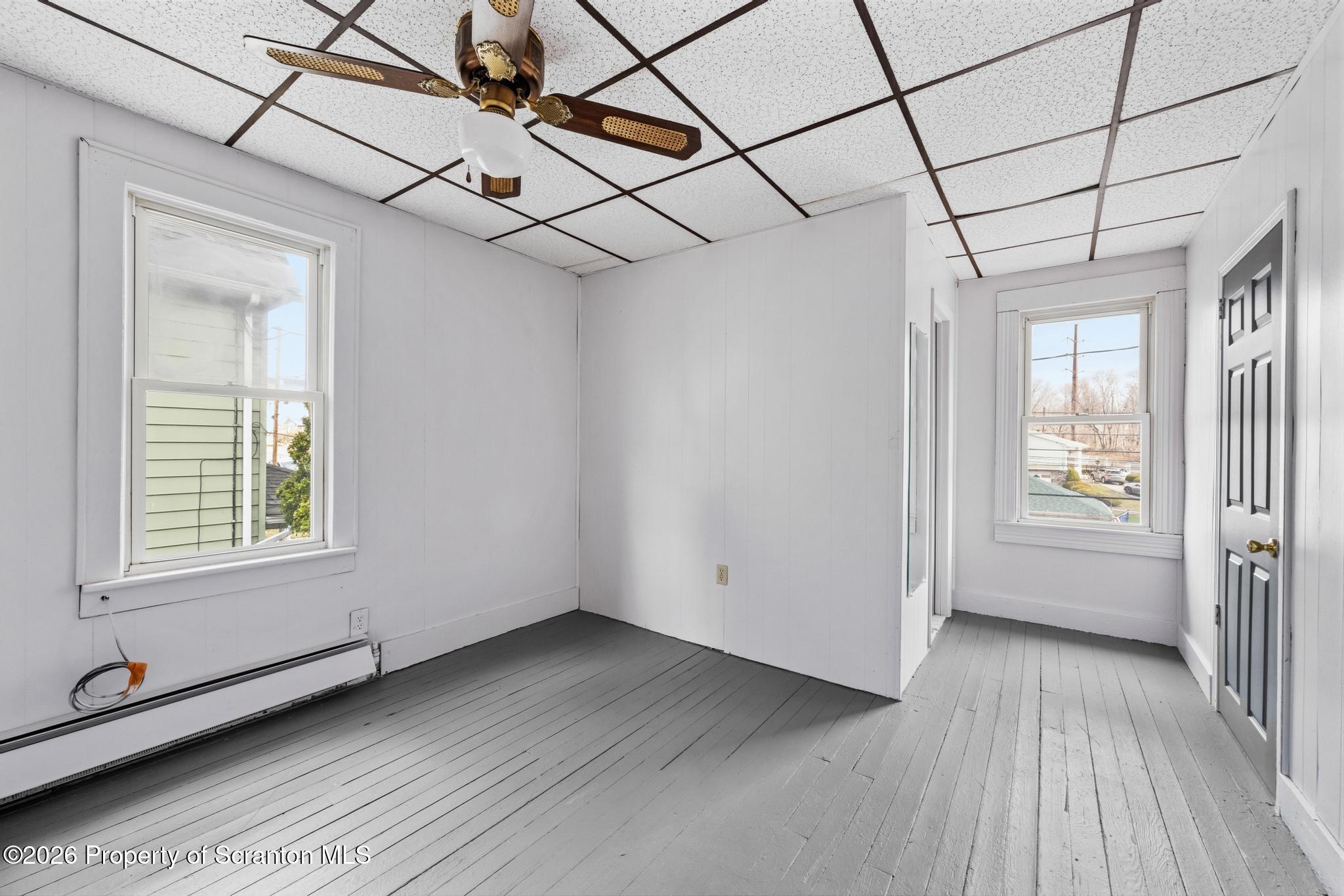 1413 Bulwer Street Scranton, PA 18504 - Photo 31 of 45 a view of a room with wooden floor and windows