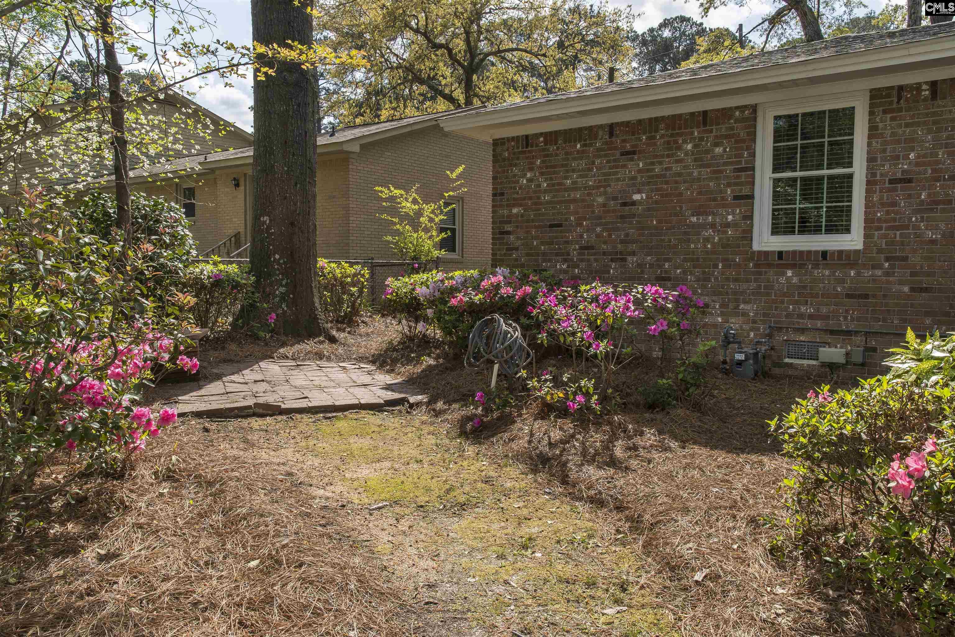 2309 Cunningham Road Columbia, SC 29210 - Photo 14 of 41 a view of a backyard with a garden