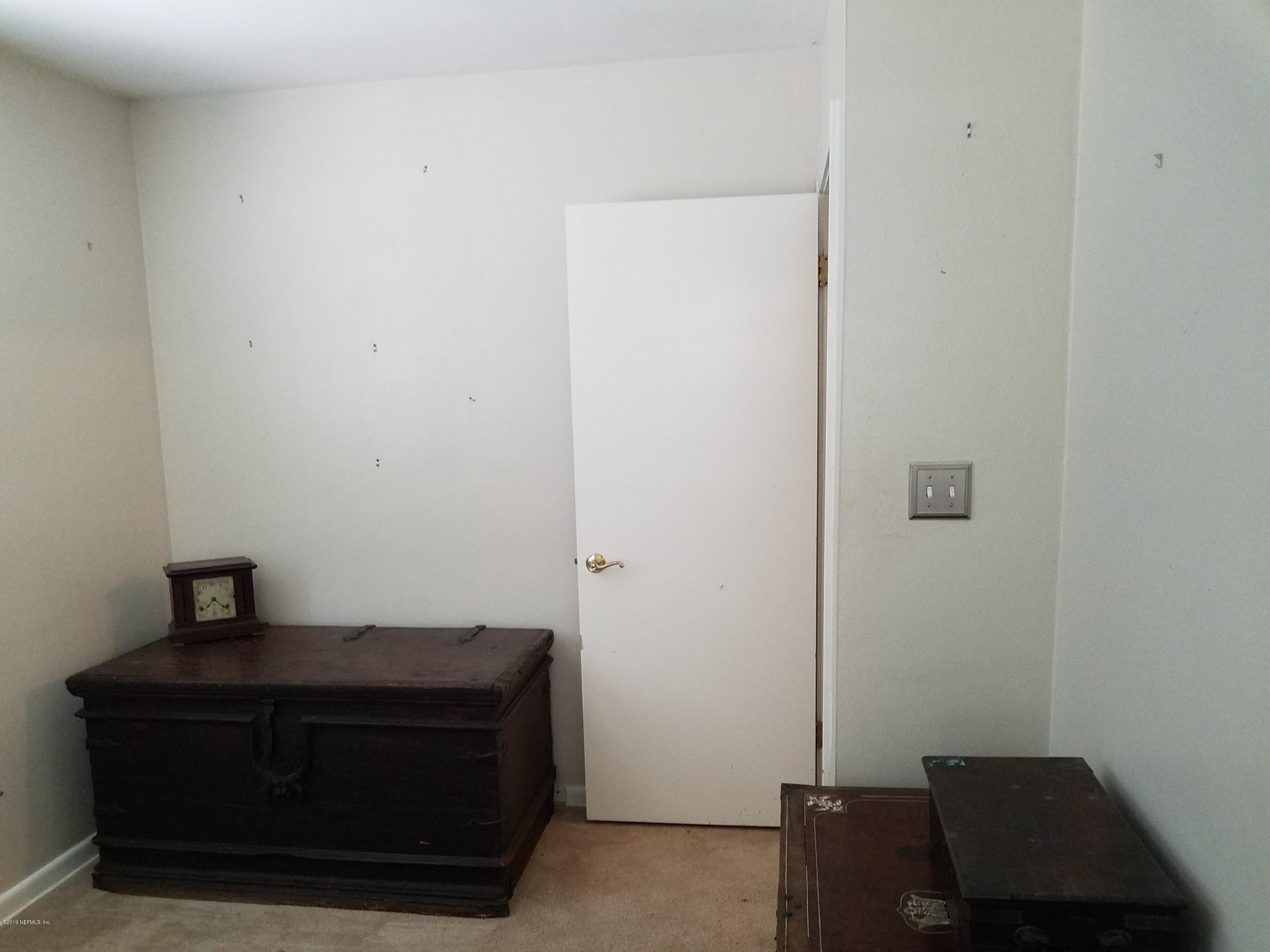 214 Southwest 40th Street Gainesville, FL 32607 - Photo 14 of 68 a view of room with furniture and wooden floor