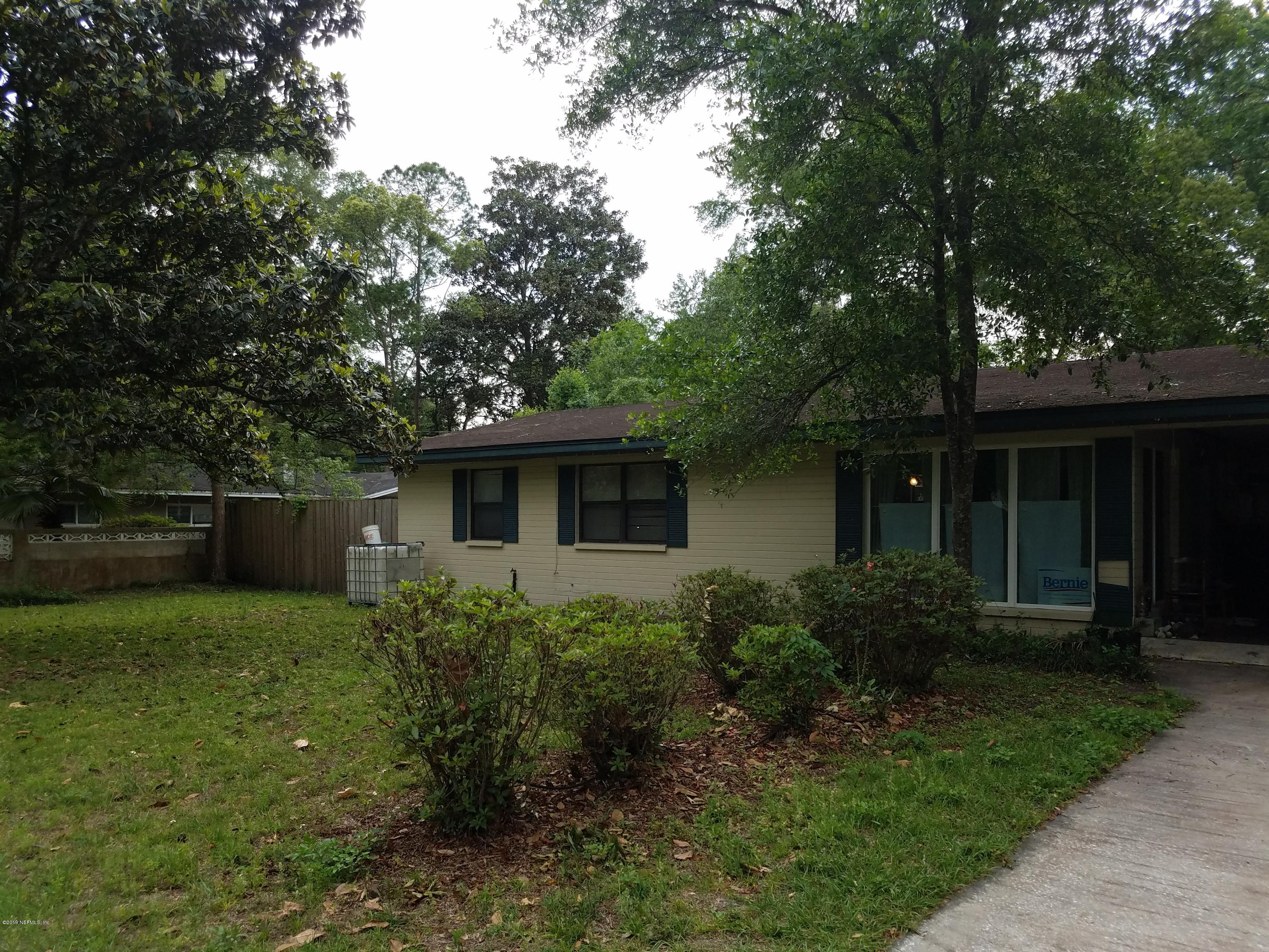 214 Southwest 40th Street Gainesville, FL 32607 - Photo 2 of 68 a front view of a house with garden