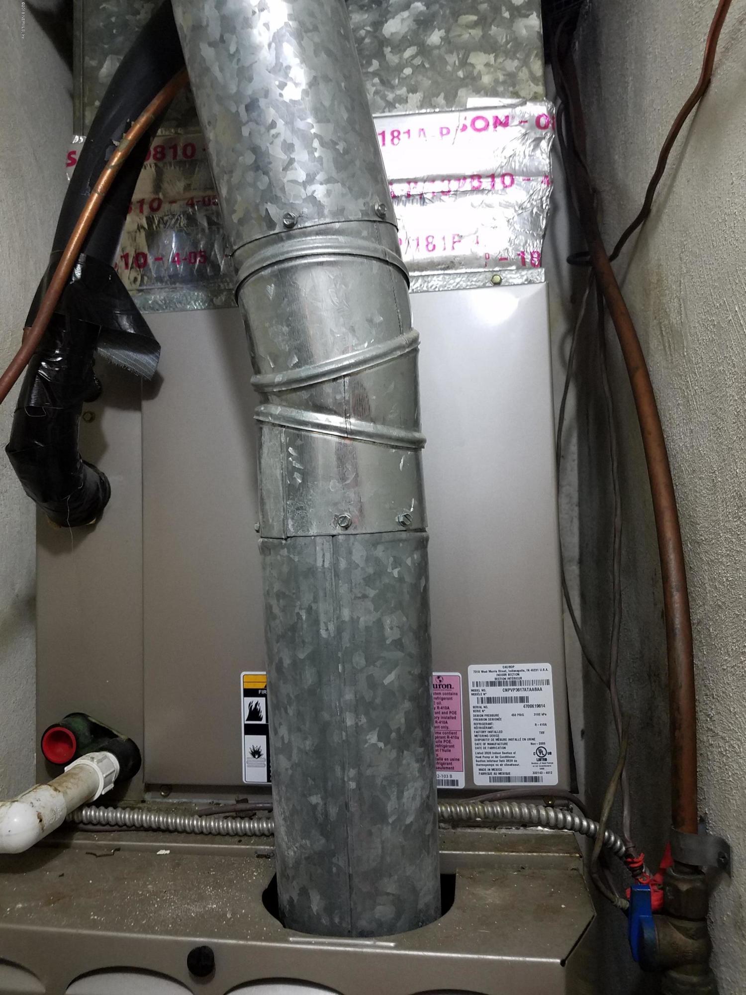 214 Southwest 40th Street Gainesville, FL 32607 - Photo 21 of 68 a close view of water heater room