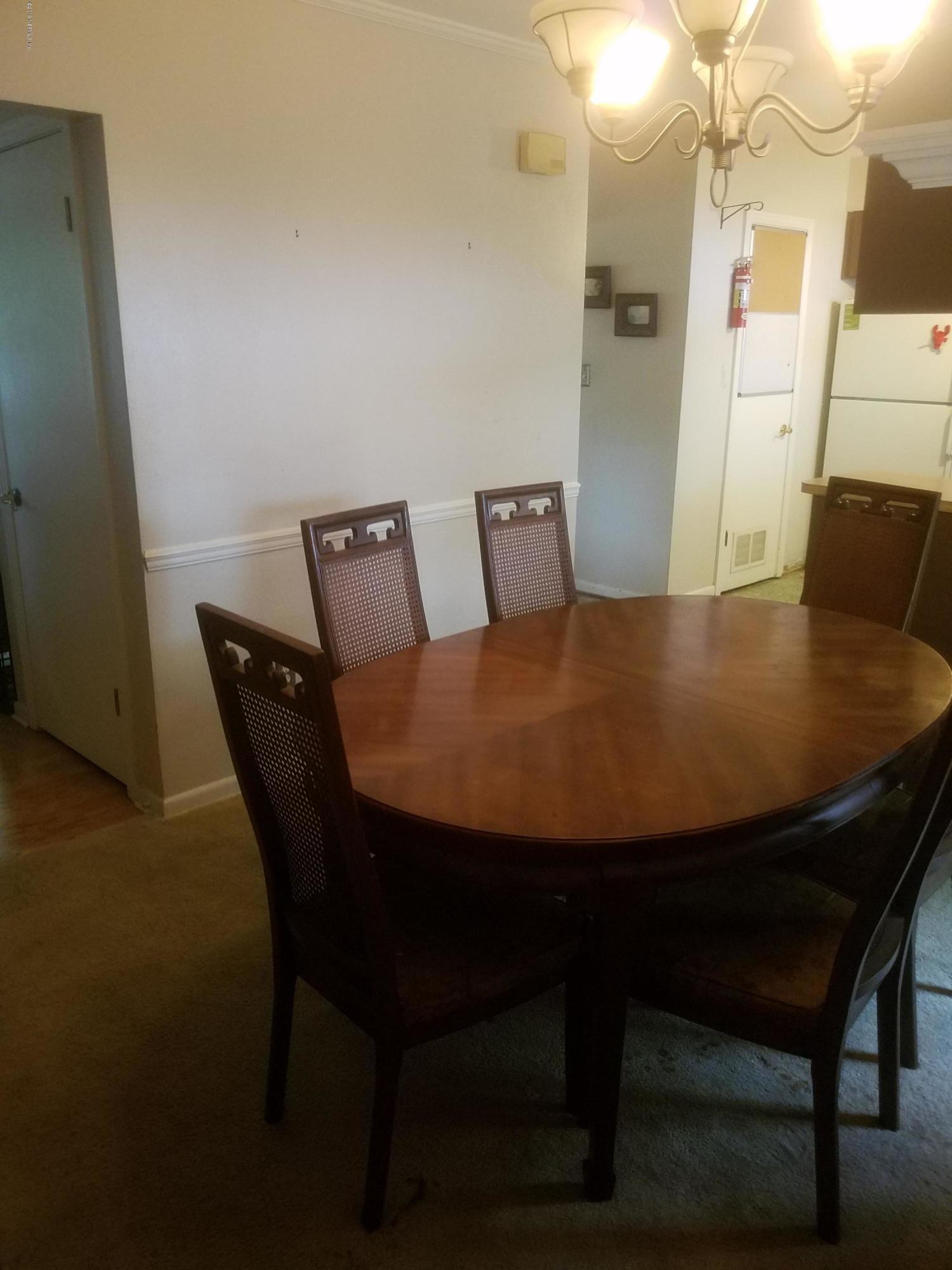 214 Southwest 40th Street Gainesville, FL 32607 - Photo 48 of 68 a view of a dining room with furniture