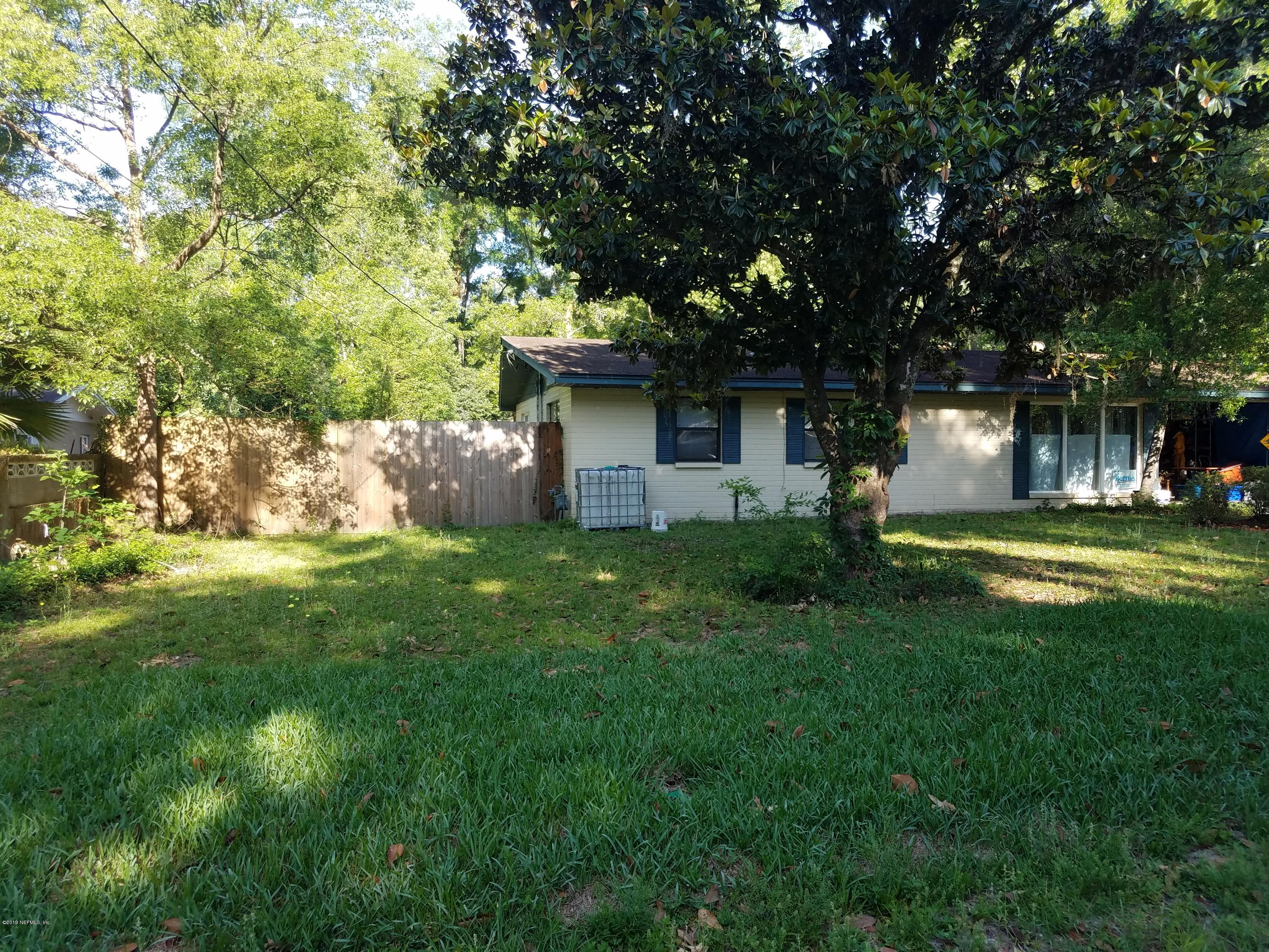 214 Southwest 40th Street Gainesville, FL 32607 - Photo 62 of 68 a view of a house with a yard