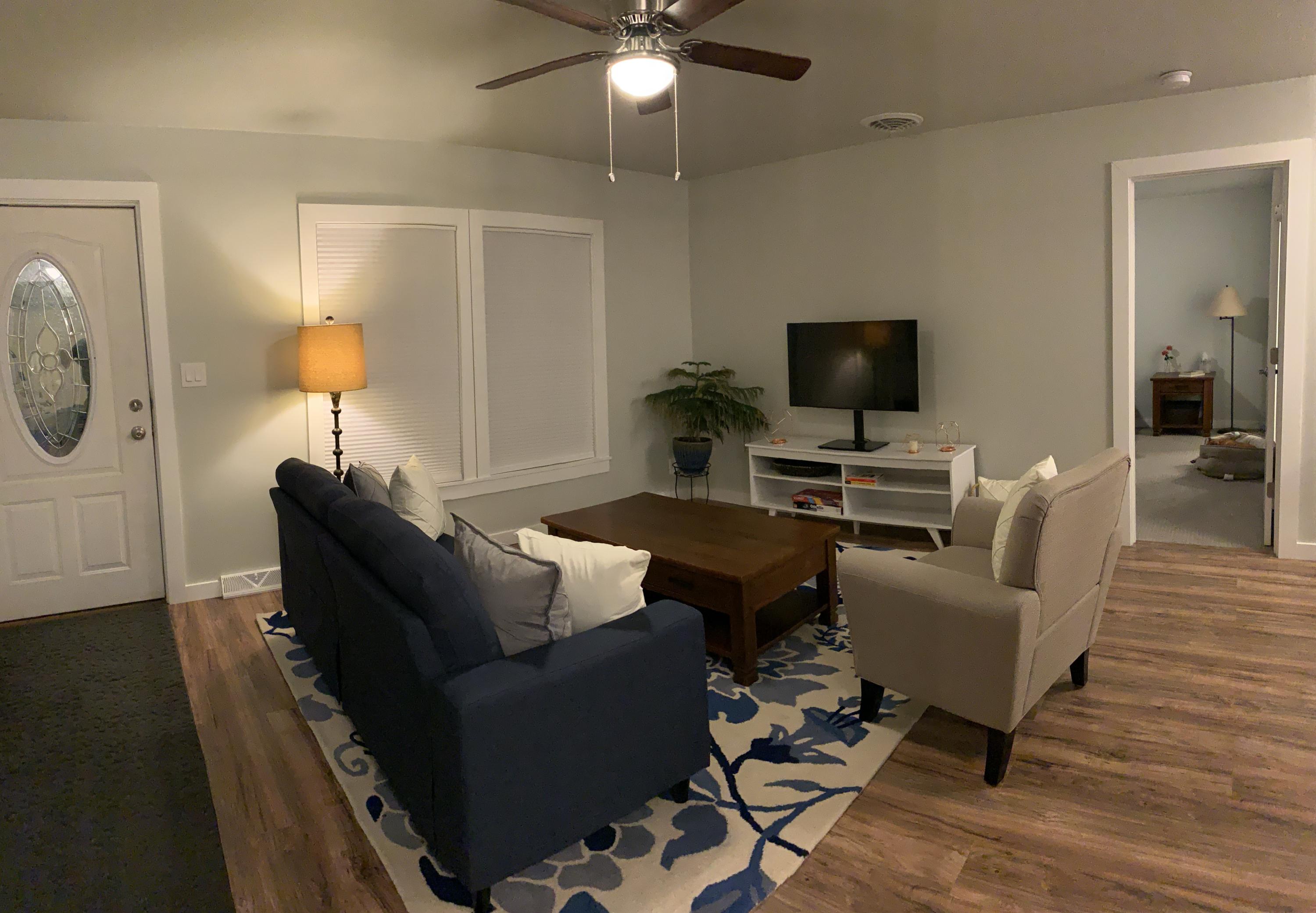 837 Alpine Road Montrose, CO 81403 - Photo 15 of 16 a living room with furniture and a flat screen tv
