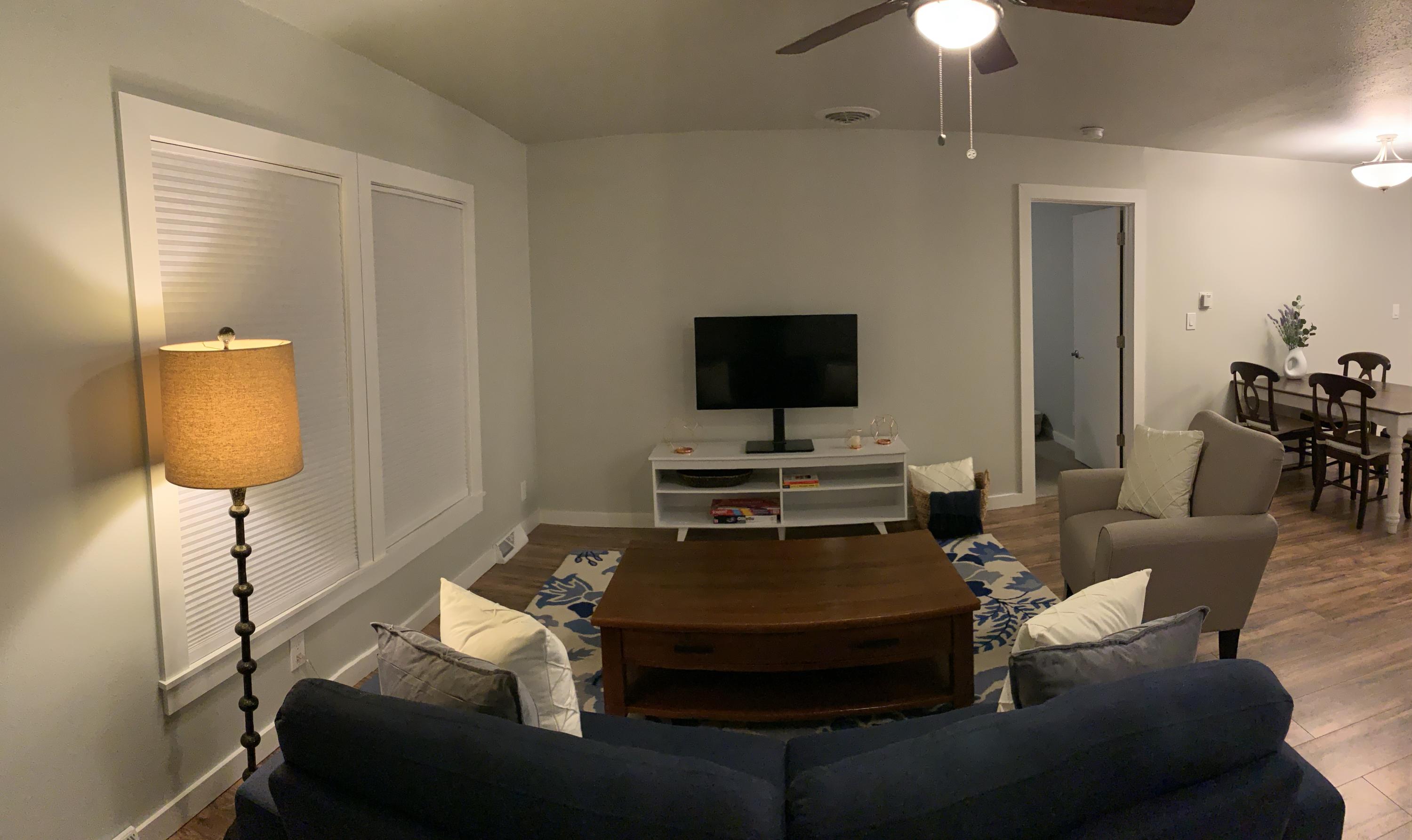 837 Alpine Road Montrose, CO 81403 - Photo 16 of 16 a living room with furniture and a flat screen tv