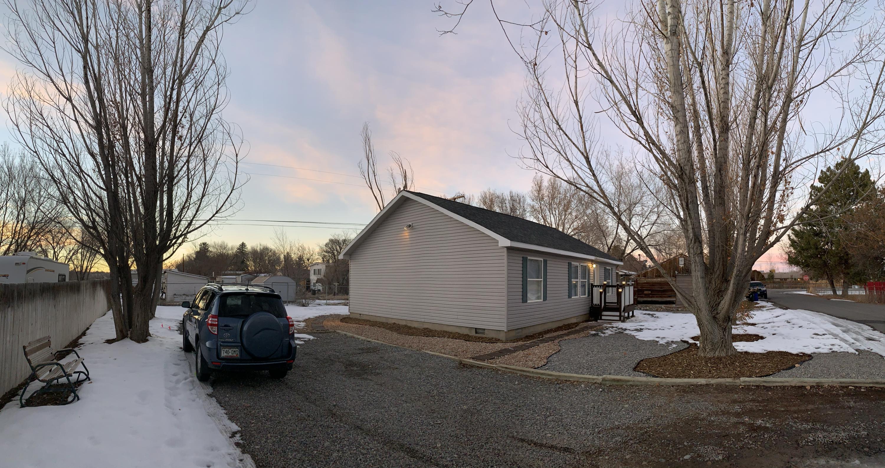 837 Alpine Road Montrose, CO 81403 - Photo 3 of 16 a view of a car park in front of house