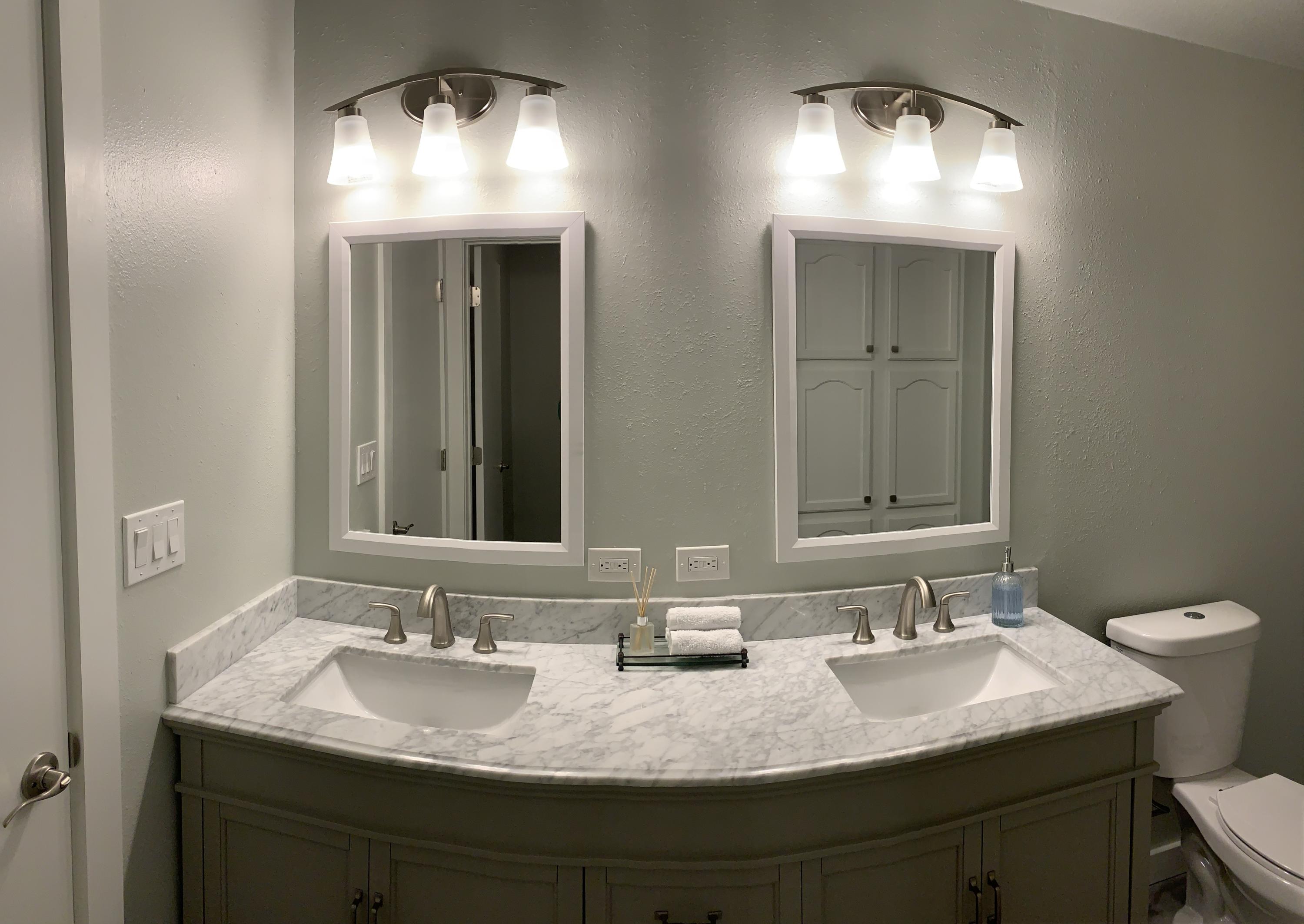 837 Alpine Road Montrose, CO 81403 - Photo 9 of 16 a bathroom with a sink and a mirror