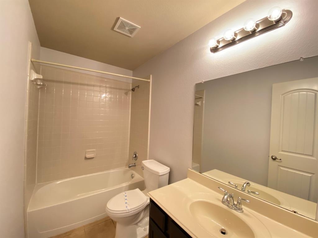 148 Meadow Crest Drive Princeton, TX 75407 - Photo 14 of 18 a bathroom with a sink toilet tub and shower