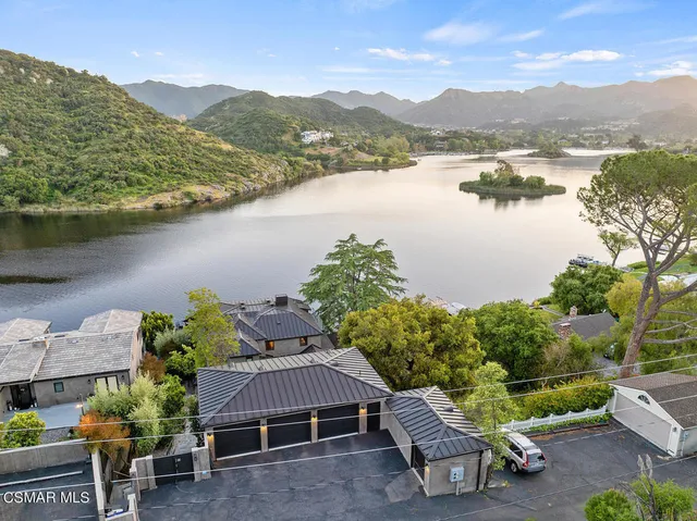 an aerial view of houses with outdoor space