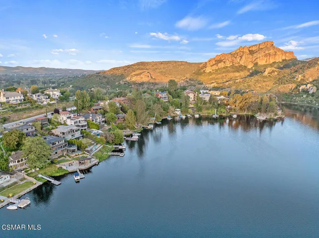a front view of a residential apartment building with a yard