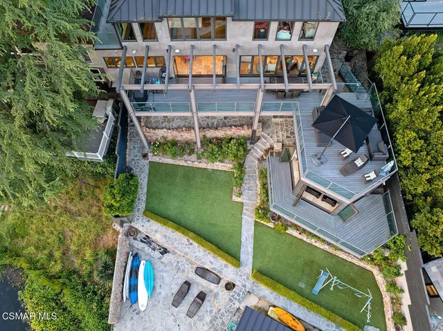 a view of a chairs and table in the patio