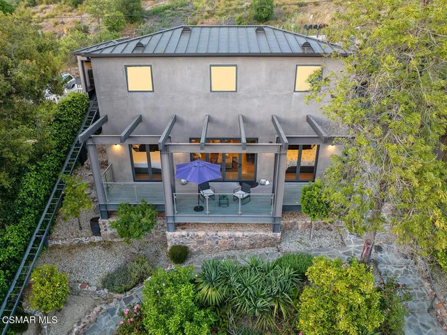 a view of a patio with furniture and wooden floor