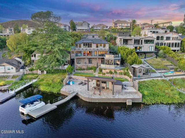 a view of a city from a patio with couches